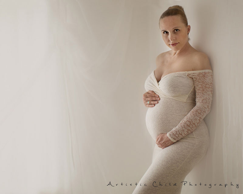 Professional London Maternity Photo Session 8 image of pregnant women in stunning lacey maternity dress