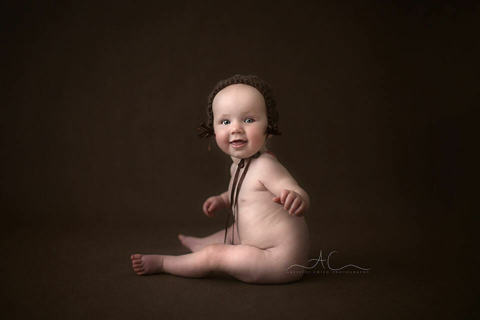 South East London Baby Photo Session | Saffron 2 photo of 8 months old baby girl in a cute brown hat | London