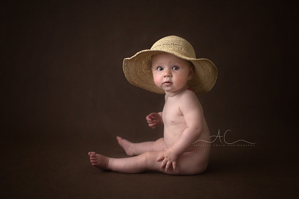 South East London Baby Photo Session | Saffron 8 baby girl wearing a straw hat | London