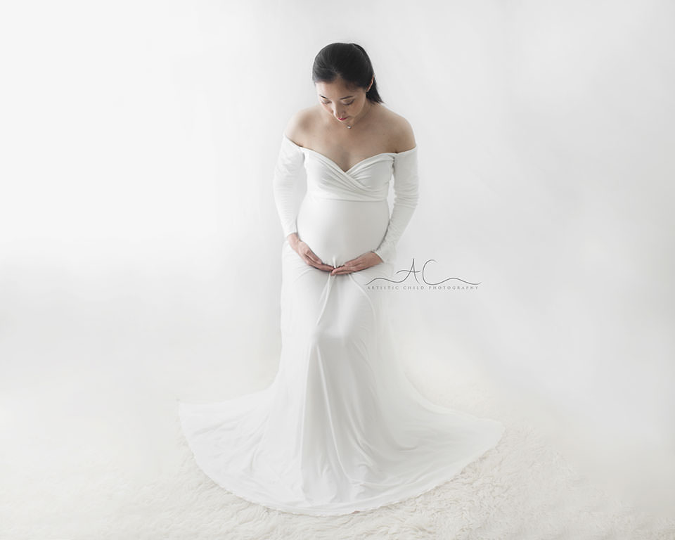 South East London Pregnancy Photographer | Phoebe 4 maternity portrait of pregnant woman looking down on her bump | London