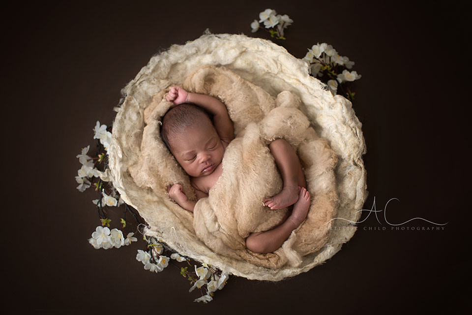 Best London Newborn Photography | Nia 2 Best London Newborn Photography | newborn baby girl sleeping in the nest surrounded by white flowers