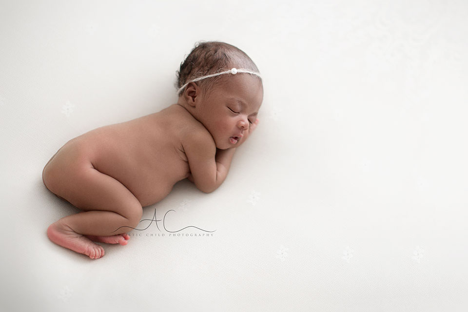 Best London Newborn Photography | Nia 4 newborn baby girl sleeping on her side | London