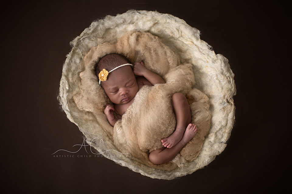 Best London Newborn Photography | Nia 5 newborn baby girl sleeping the the nest coved with wool | London