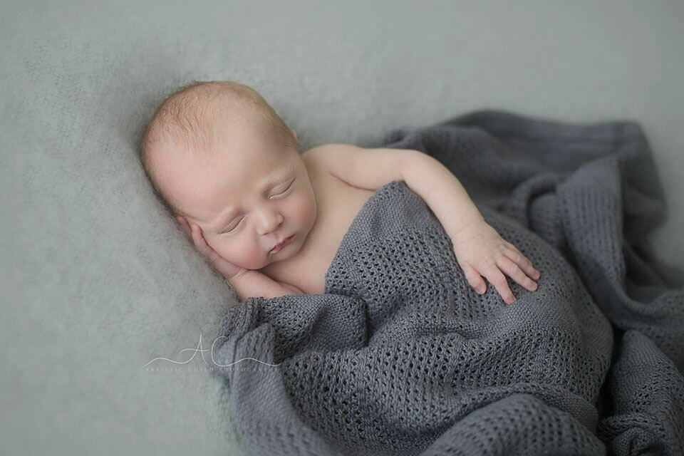 Beautiful London Newborn Images | Bay 2 newborn baby boy sleeping peacefully under a grey blanket | London