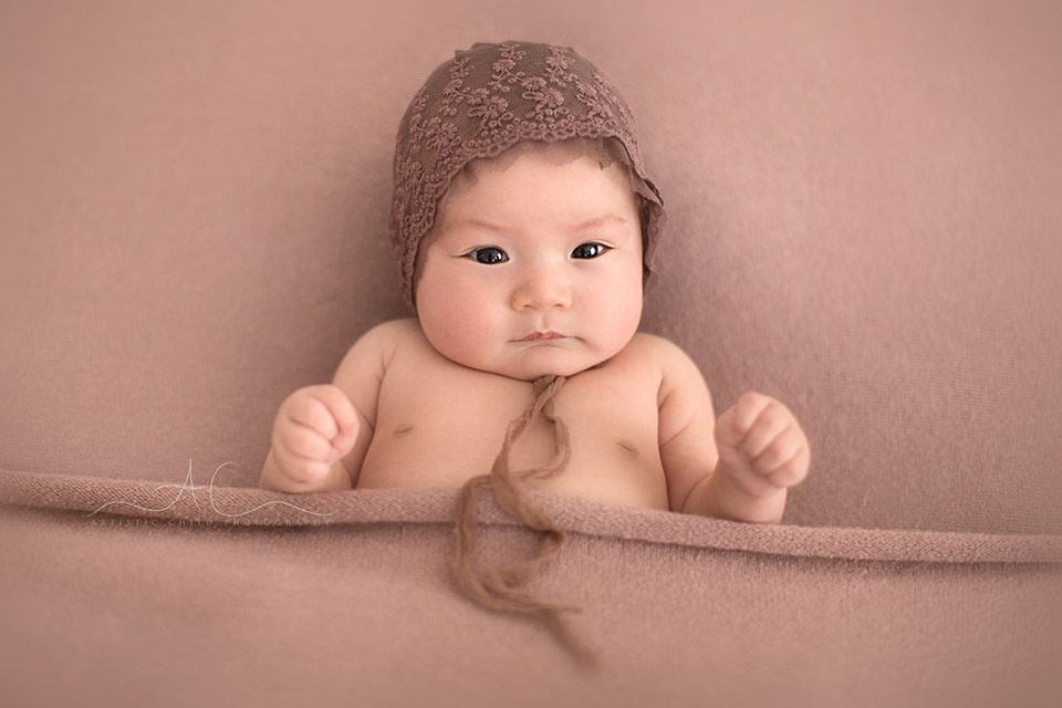 Professional Bromley Baby Images | Eleanor 2 3 months old baby girl wearing a cute hat | London