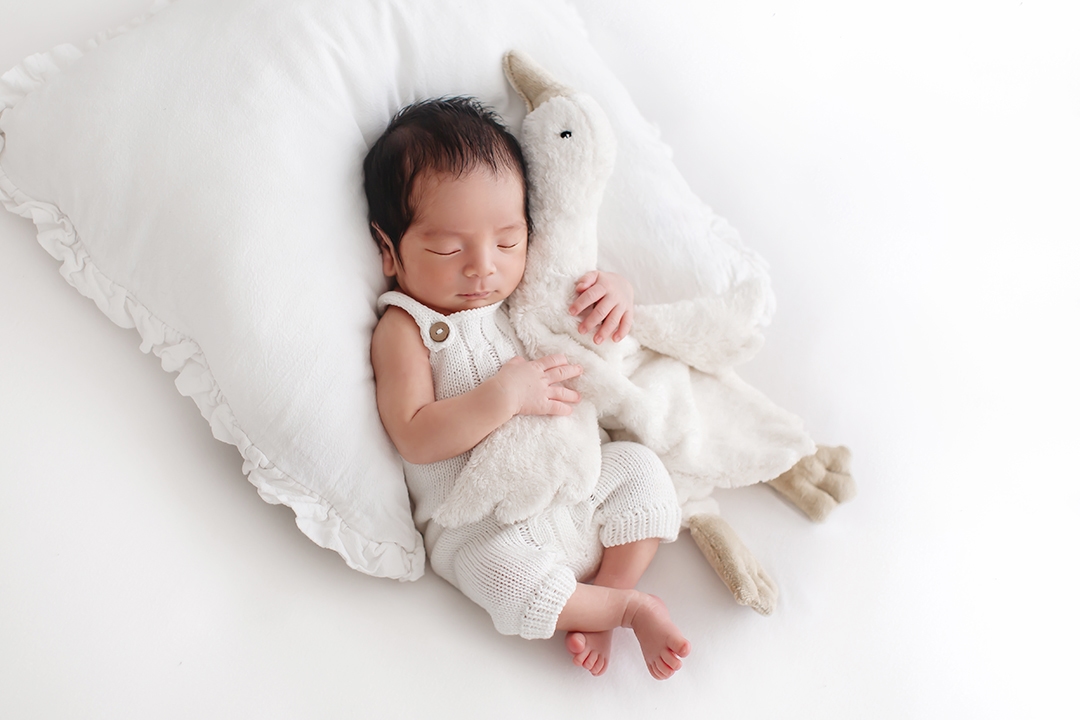 Bromley Newborn Photo session | newborn baby boy sleeping on a white pillow