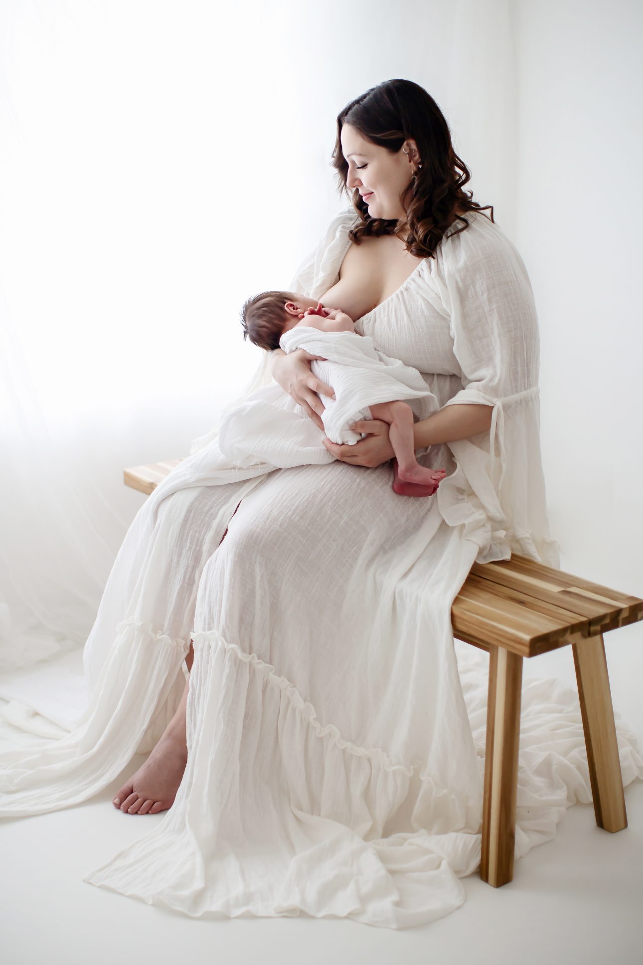 Bromley Newborn Photographer | a mum breastfeeding her newborn baby boy during  a newborn photoshoot in my studio in Bromley