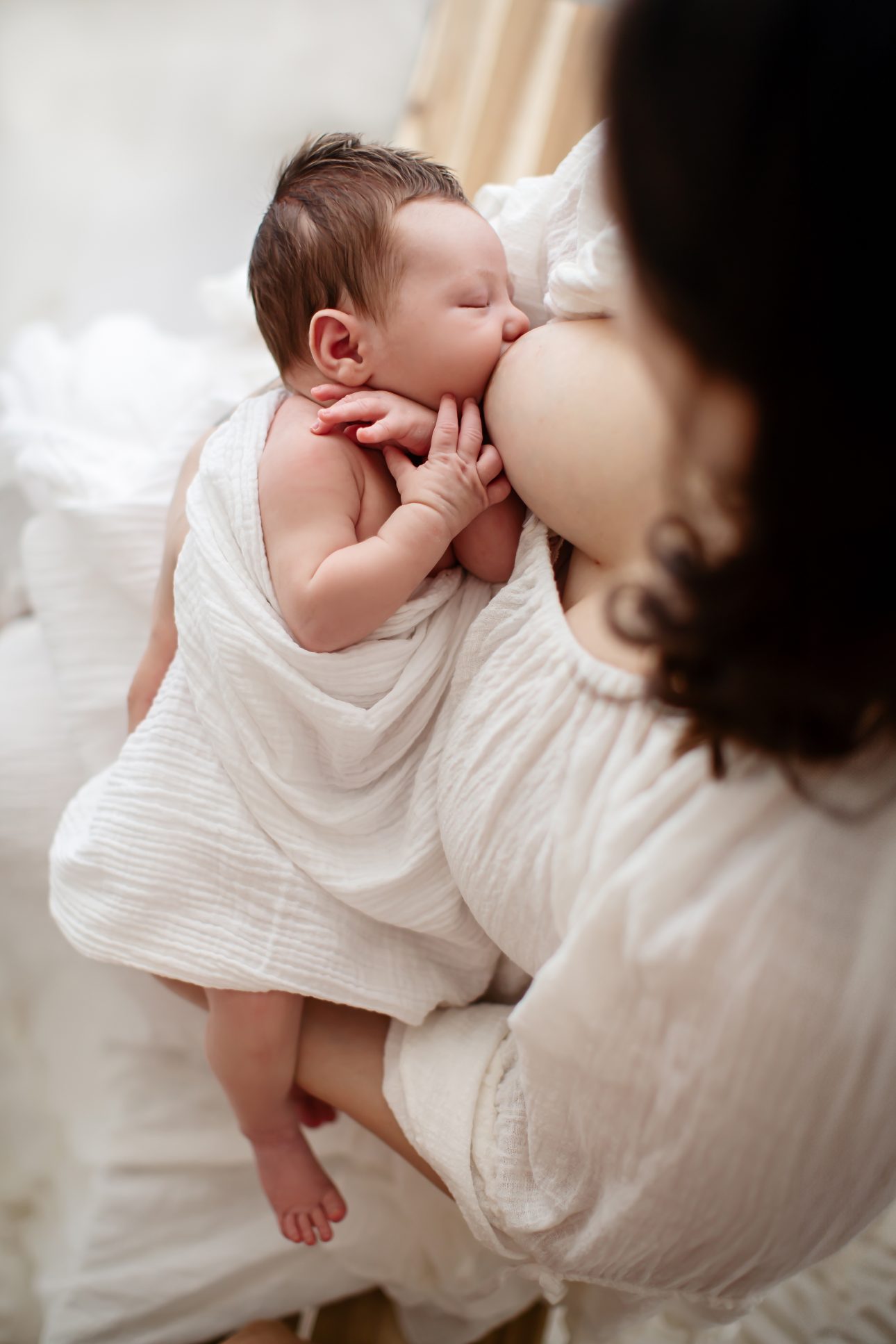 Bromley Newborn Photographer | portrait of a newborn baby breastfeeding