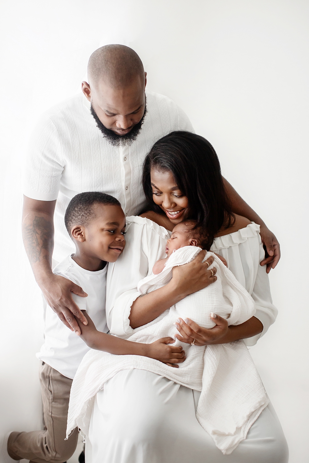 Bromley Newborn Photography | a family of 4 portrait taken during a newborn session in Bromley