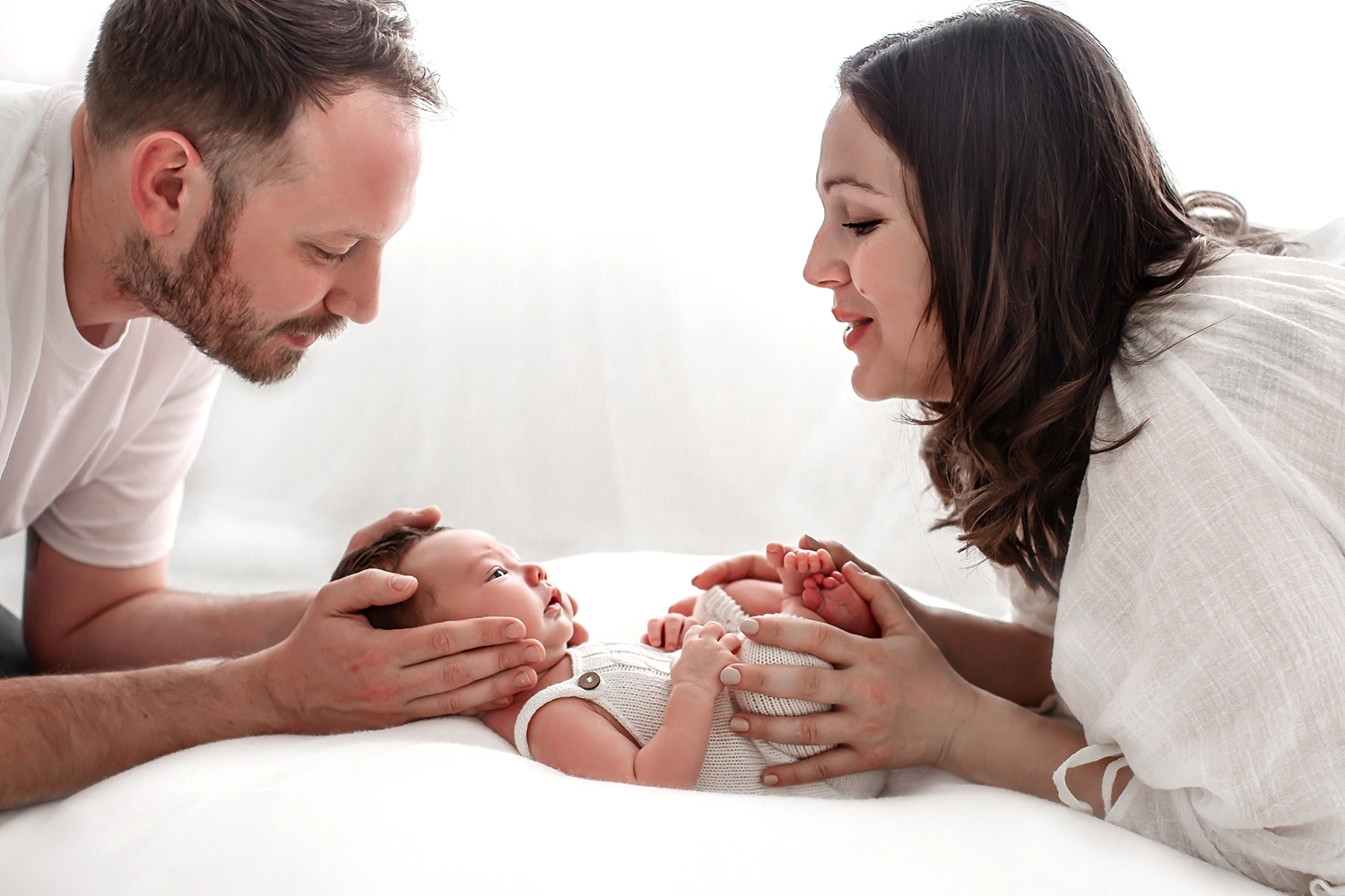 Bromley Newborn Photography | portrait of parents looking at their newborn baby during a newborn photo session in my home studio in Bromley