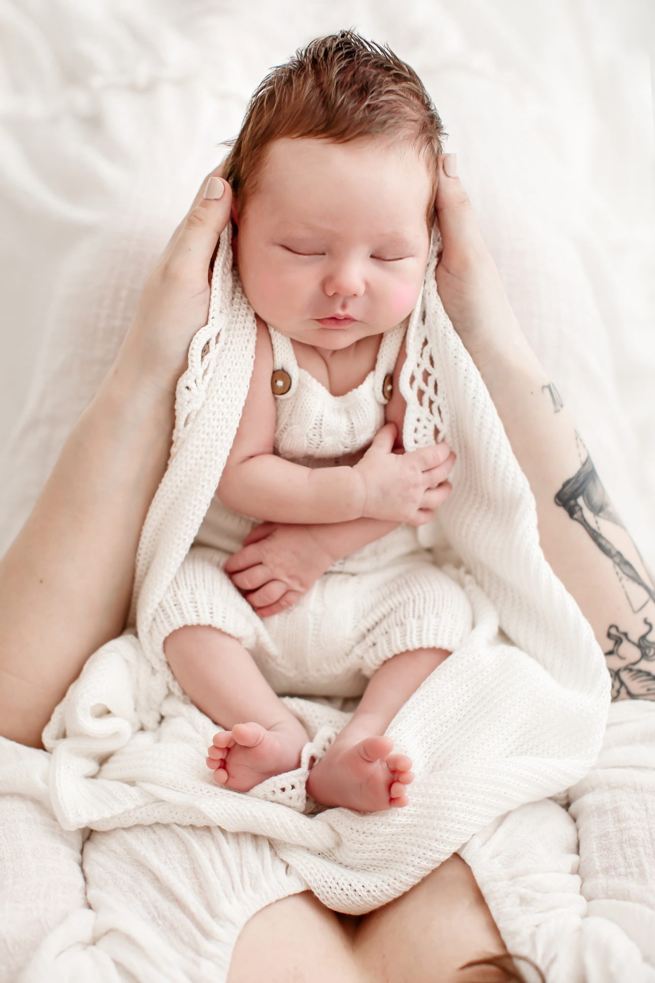 Bromley Newborn Photoshoot | a portrait of a newborn baby boy in a white blanket