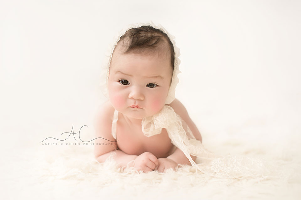Professional London Baby Girl Portraits | Eleanor 7 portrait of a 3 months old baby girl in a cute white hat | London