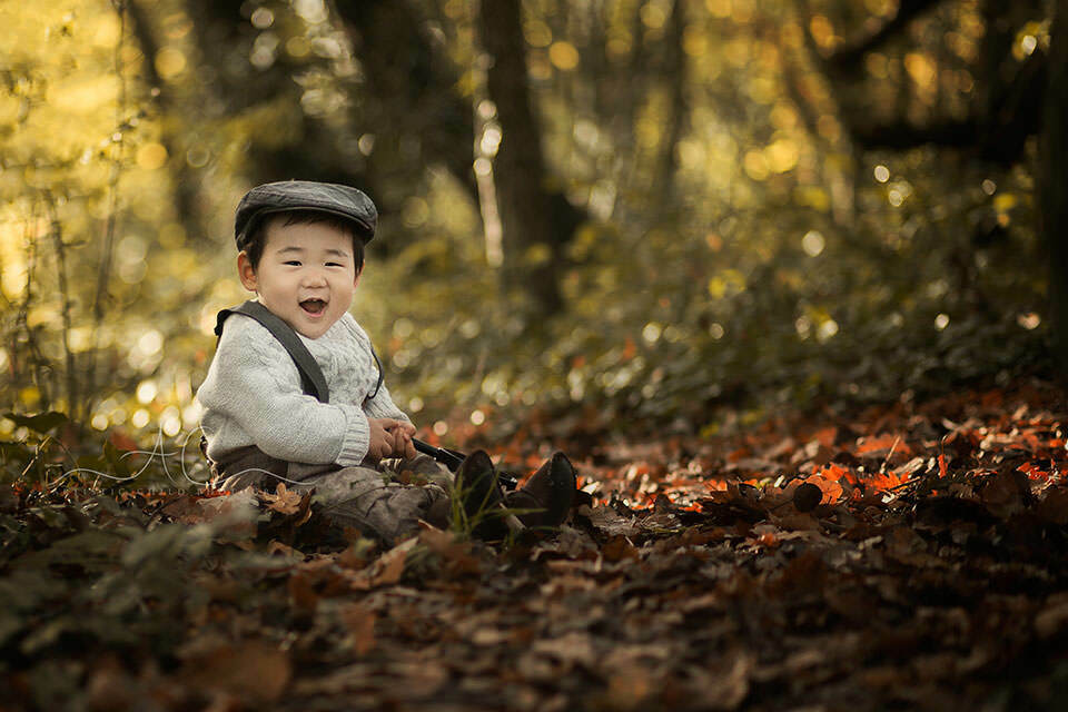 Professional London Toddler Portraits | Yeojun 2 outdoor portrait of 1 year old boy playing happily in the park | London