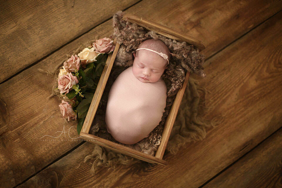 South East London Newborn Baby Girl Photographer | Ines 3 newborn baby girl sleeping in a tiny wooden bed prop | London