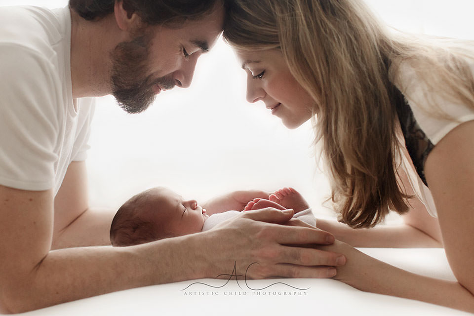 Bromley Newborn Baby Portraits | Ethan 3 Bromley Newborn Baby Portraits | parents looking at his newborn baby boy