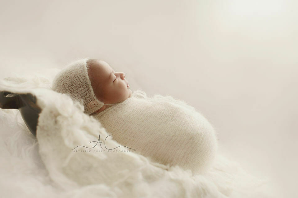 Bromley Newborn Baby Portraits | Ethan 4 newborn baby boy sleeping in wooden trench bowl | London