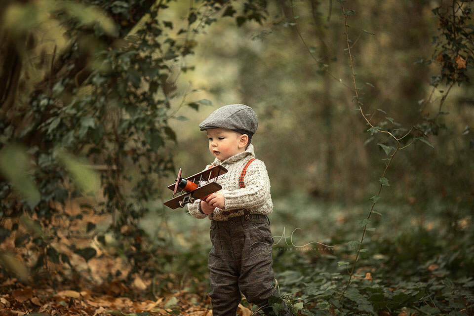 Professional Bromley Toddler Photos | Jacob 3 18 months old boy flying his wooden plane in the park | London