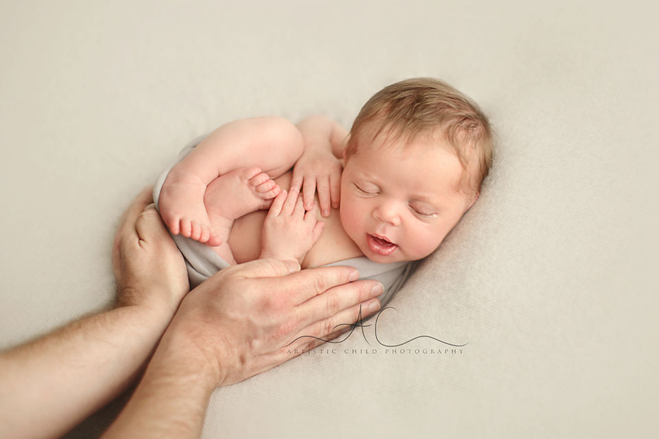 South East London Newborn Baby Boy Images | Finn 4 newborn baby boy sleeping in daddy's hands | London