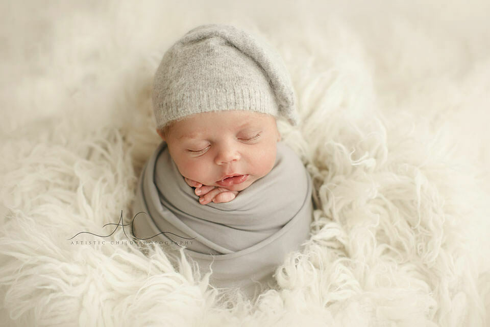 South East London Newborn Baby Boy Images | Finn 3 portrait of a newborn baby boy posed in a potato sack pose| London
