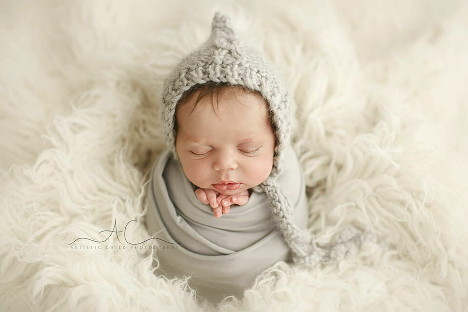 South East London Newborn Baby Boy Images | Finn 8 portrait of a newborn baby boy wearing a hand knitted grey hat | London