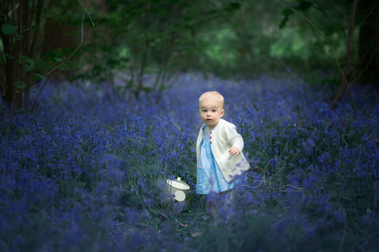 South East London Toddler Photography Services | Freya 10 South East London Toddler Photography Services | 12 months old baby standing in the middle of bluebells flowers