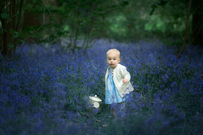 South East London Toddler Photography Services | 12 months old baby standing in the middle of bluebells flowers