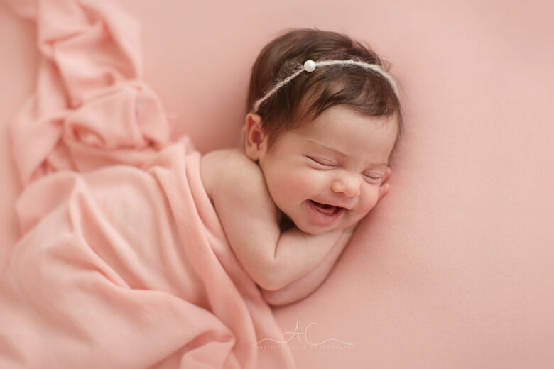 Professional Bromley Newborn Photo Session | newborn baby girl smiling