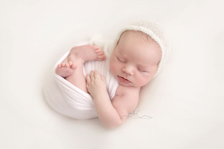 Studio London Newborn Photography | Michal 5 Studio London Newborn Photography | photo of a newborn baby boy wearing a white hand knitted hat