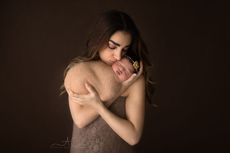 South East London Family Photography Offer | mother kissing her newborn baby girl