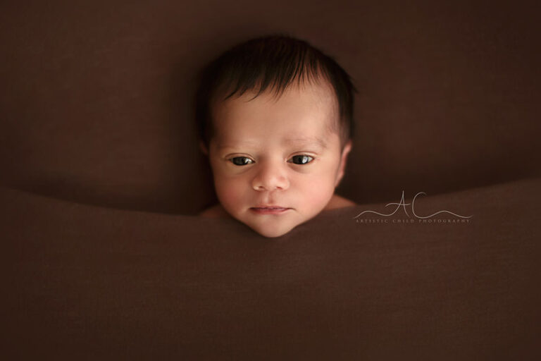 Bromley Newborn Baby Boy Photos | a close up portrait of an awake newborn baby boy