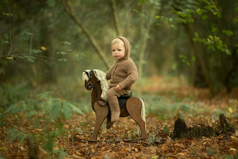 Professional South East London Toddler Pictures | Leon 3 Professional South East London Toddler Pictures | portrait of 15 months old toddler boy sitting on a wooden rocking horse