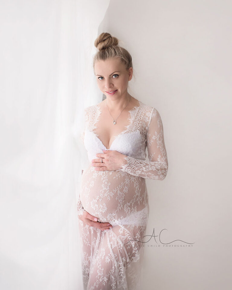 Bromley Maternity Photography | photo of an expecting woman in white lace dress