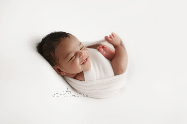 South East London Newborn Baby Boy Photography Services | photo of a newborn baby boy smiling