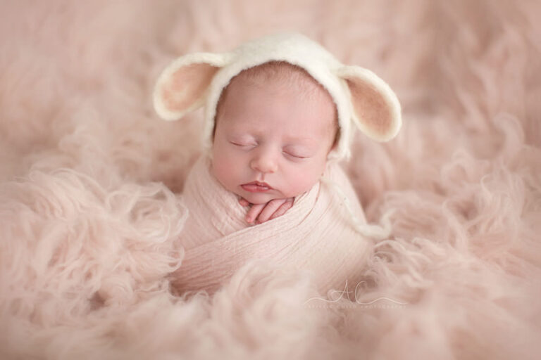 Professional Bromley Newborn Baby Pictures | Clara 11 Professional Bromley Newborn Baby Pictures | portrait of a newborn baby girl wearing a cute sheep ear hat