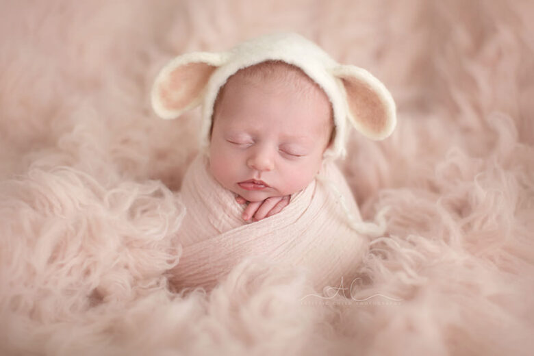 Professional Bromley Newborn Baby Pictures | portrait of a newborn baby girl wearing a cute sheep ear hat