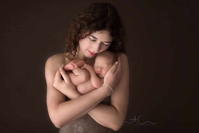 Bromley Family Photographer | intimate portrait of a new mother holding her newborn baby boy