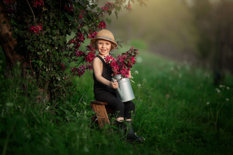 Top London Child Spring Photography | portrait of a 4 year old boy holding flowers