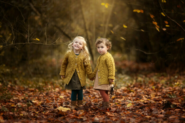 Magical Autumn London Sibling Photoshoot | autumnal portrait of sisters holding hands in a park