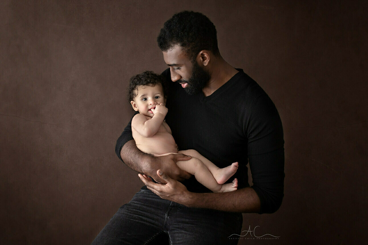 Top South East London Family Portraits | Vincent 3 Top South East London Family Portraits | father holds his 5 months old son in his arms