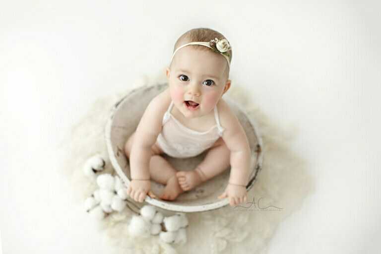 Top South East London Baby Girl Photos | beautiful portrait of a stunning baby girl pictured in a white wooden bowl