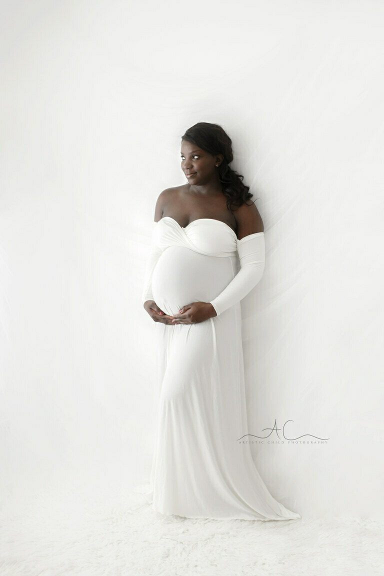 Best South East London Pregnancy Images | full body maternity portrait of a pregnant woman wearing a white dress