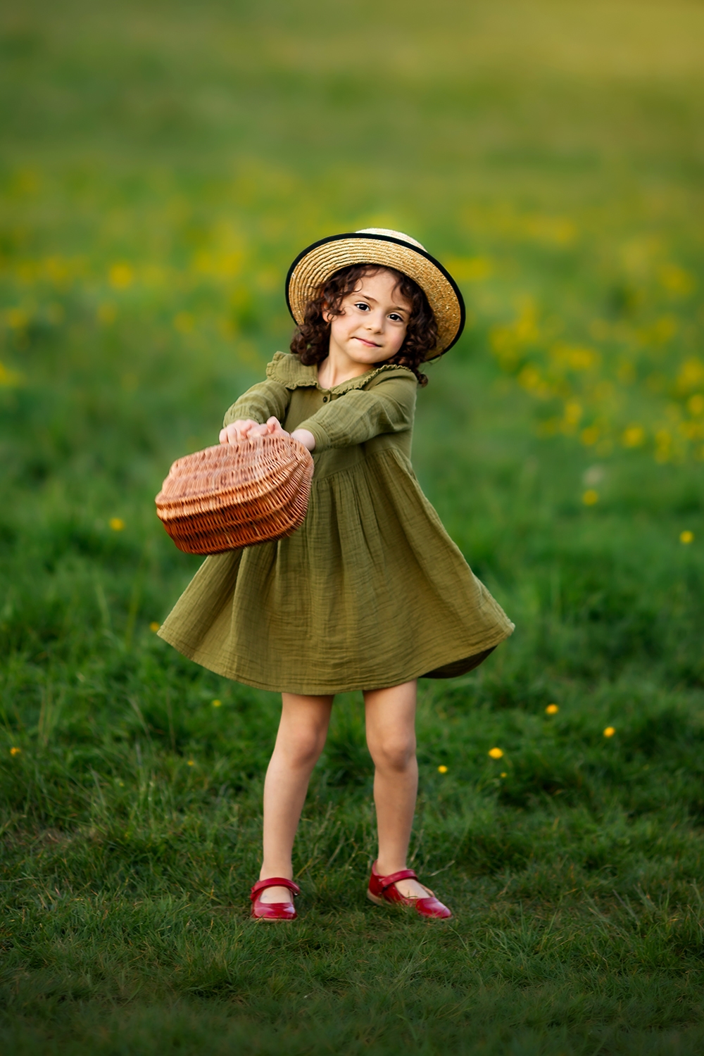 London Spring Mini Sessions | a girl playing with a wicker basket in a grass field in London park