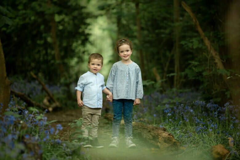 Magical London Siblings Photo Session | brother and sister holding hands during bluebells walk