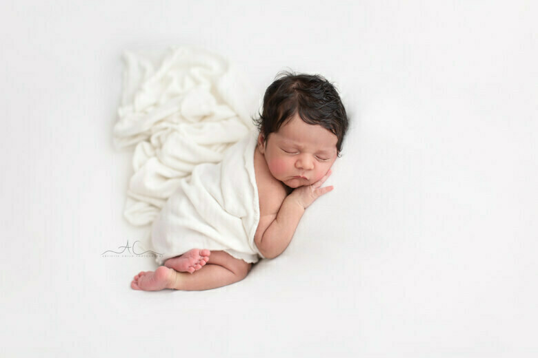 Amazing South East London Newborn Photos | portrait of a newborn baby girl sleeping on her tummy