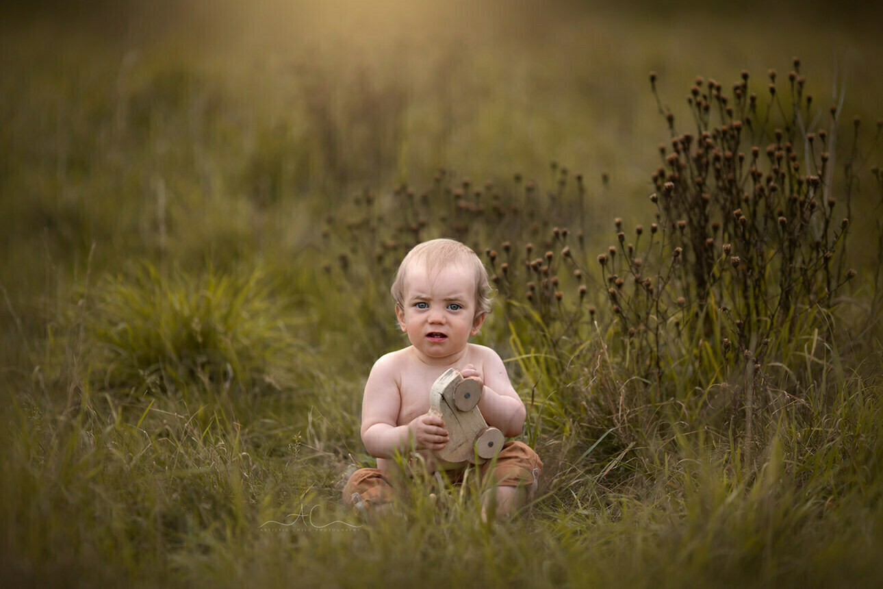6 Gorgeous Bromley Toddler Pictures | Gabriel 4 image of a 1 year old boy playing with an wooden car toy | Bromley