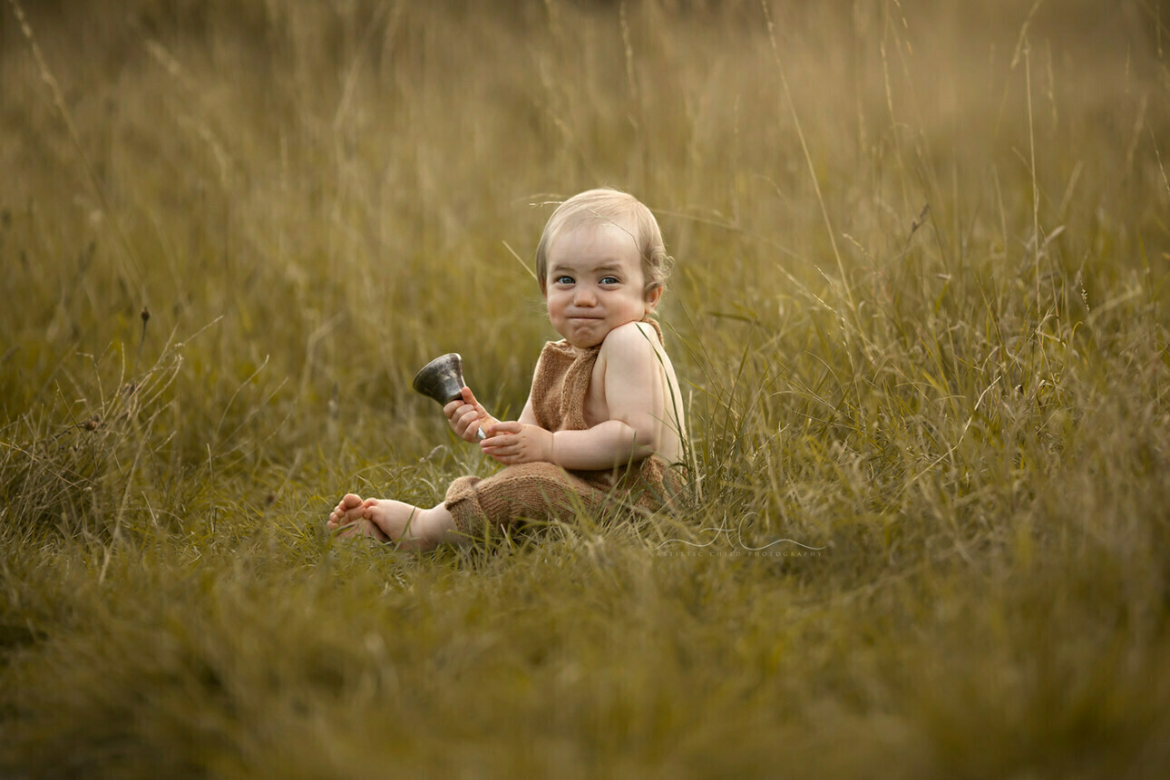 6 Gorgeous Bromley Toddler Pictures | Gabriel 6 Gorgeous Bromley Toddler Pictures | 1 year old boy laughts while playing with the bell during an outdoor photo session