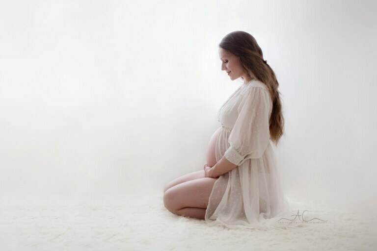 Best Bromley Maternity Photographer | Paulina 3 Best Bromley Maternity Photographer | backlit portrait of a pregnant woman holding her bump