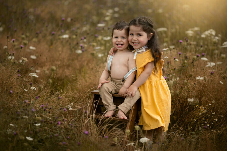 Magical London Brother & Sister Photoshoot | brother and sister portrait in wildflowers field