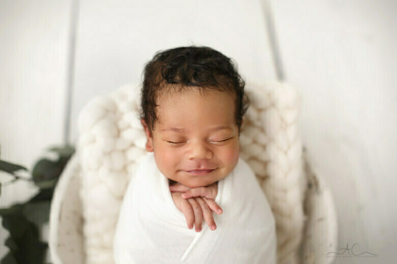 Best Bromley Newborn Baby Images | a smily newborn baby boy