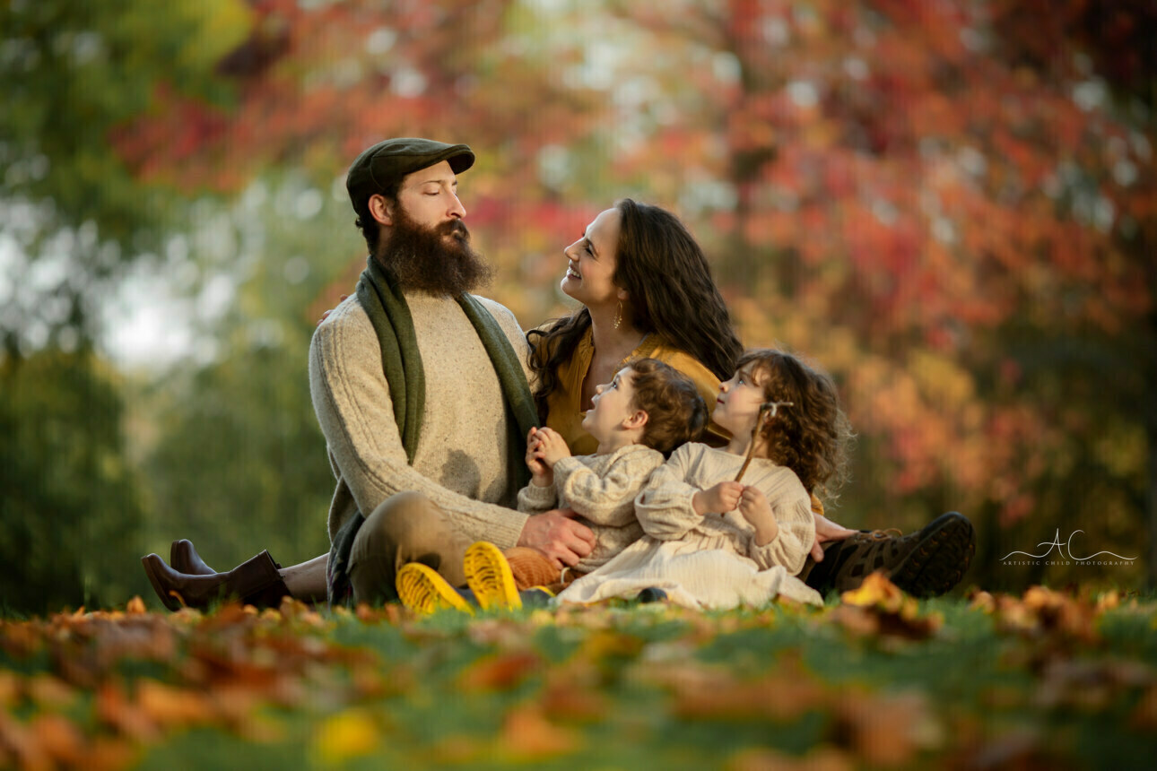 Stunning Autumn London Family Portraits | portrait of a family of 4 looking up at their Dad